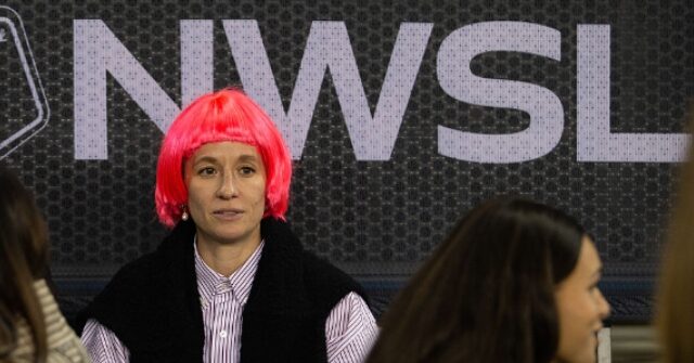 Megan Rapinoe looks on during